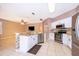 Bright kitchen with stainless steel appliances, tile backsplash, and peninsula seating at 2753 Joseph Cir, Oviedo, FL 32765