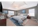 Serene main bedroom with a tray ceiling, neutral paint, carpet, and a plush king-sized bed at 2753 Joseph Cir, Oviedo, FL 32765