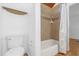 Bright bathroom featuring a tub shower with shower curtain and built-in shelves at 2923 Cornell Ave, Orlando, FL 32804