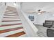 Bright and airy staircase leading to a living room with modern flooring and neutral decor at 2923 Cornell Ave, Orlando, FL 32804