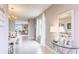 Inviting entryway featuring tile flooring, decorative lighting, and a glimpse into the dining and living areas at 2981 Moulin Rd, Davenport, FL 33837