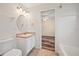 Cozy bathroom featuring a sink and vanity with a view into the bedroom at 330 Hickory Springs Ct, Debary, FL 32713