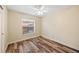 Comfortable bedroom with natural light and ceiling fan at 330 Hickory Springs Ct, Debary, FL 32713