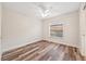 Well-lit bedroom with wood-look flooring and a ceiling fan at 330 Hickory Springs Ct, Debary, FL 32713