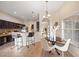 Well-lit dining area shows tile floors, view to the kitchen, and room for seating four at 330 Hickory Springs Ct, Debary, FL 32713