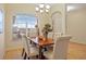 Bright dining area with a large window, tile floors and comfortable seating at 330 Hickory Springs Ct, Debary, FL 32713