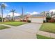 Inviting single-Gathering home boasting a spacious driveway and lush green lawn, perfect for suburban living at 330 Hickory Springs Ct, Debary, FL 32713