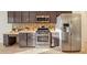 Kitchen featuring stainless steel appliances, tile backsplash, and ample counter space at 330 Hickory Springs Ct, Debary, FL 32713