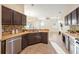 Functional kitchen with modern appliances and tile floors that connects to the dining area at 330 Hickory Springs Ct, Debary, FL 32713