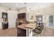 Well-lit kitchen features stainless steel appliances, dark wood cabinetry and breakfast bar with seating at 330 Hickory Springs Ct, Debary, FL 32713