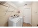 Laundry room with white washer, dryer, and wire shelving at 330 Hickory Springs Ct, Debary, FL 32713