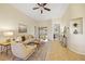 Inviting living room with a large window, comfortable seating, and tile flooring at 330 Hickory Springs Ct, Debary, FL 32713