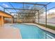 Inviting screened-in pool area, perfect for enjoying refreshing swims and outdoor relaxation at 330 Hickory Springs Ct, Debary, FL 32713