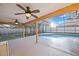 Inviting screened-in pool area with ceiling fans, perfect for outdoor entertaining and relaxation at 330 Hickory Springs Ct, Debary, FL 32713