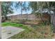 Backyard featuring a wooden fence, grass, and landscaping at 350 Lakebreeze Cir, Lake Mary, FL 32746