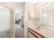 The bathroom has a single sink vanity, a large mirror, and doorway to bedroom at 350 Lakebreeze Cir, Lake Mary, FL 32746