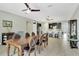 Well-lit dining room showcasing an elegant table and chairs, complemented by modern lighting and décor at 3504 Cayugas Loop, St Cloud, FL 34772