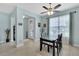 Inviting dining area featuring stylish light fixtures and ample natural light at 3504 Cayugas Loop, St Cloud, FL 34772