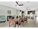 Inviting dining area with a wooden table, set against a backdrop of stylish furnishings and neutral tones at 3504 Cayugas Loop, St Cloud, FL 34772