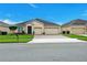 Beautiful single-story home featuring a two-car garage and landscaped front yard at 3504 Cayugas Loop, St Cloud, FL 34772