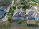 Aerial view of the property with a fenced backyard featuring a pool, a patio, and mature landscaping at 3569 Bellington Dr, Orlando, FL 32835