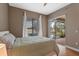 Bedroom featuring a bed and sliding glass doors leading to a screened-in pool area at 3569 Bellington Dr, Orlando, FL 32835