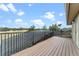 A spacious outdoor deck area with black metal railings and a view of the community at 3569 Bellington Dr, Orlando, FL 32835