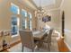 Chic dining room boasting coffered ceilings, wainscoting and a decorative chandelier at 3569 Bellington Dr, Orlando, FL 32835