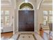 Elegant foyer with a grand double door entrance and tiled flooring at 3569 Bellington Dr, Orlando, FL 32835