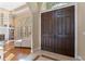 Inviting foyer showcasing beautiful hardwood floors and a charming double door entrance at 3569 Bellington Dr, Orlando, FL 32835