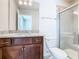 Bathroom featuring tiled glass door shower, toilet, and granite vanity at 3751 Lana Ave, Davenport, FL 33897