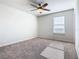 This bedroom features neutral walls, carpet flooring, and a ceiling fan at 3751 Lana Ave, Davenport, FL 33897