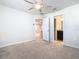 Well-lit bedroom featuring neutral walls, and carpet, plus an adjacent bathroom at 3751 Lana Ave, Davenport, FL 33897