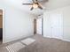 Neutral bedroom featuring carpet flooring, ceiling fan, and closet at 3751 Lana Ave, Davenport, FL 33897