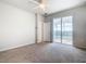 Bedroom features a ceiling fan, carpet flooring, and a sliding glass door to the pool area at 3751 Lana Ave, Davenport, FL 33897