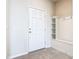 Inviting foyer featuring a bright white door, tiled floor and convenient built-in storage at 3751 Lana Ave, Davenport, FL 33897