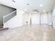 Expansive living room featuring tile floors and a staircase at 3751 Lana Ave, Davenport, FL 33897