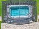 Aerial view of a screened-in pool with stone pavers and clear blue water at 3751 Lana Ave, Davenport, FL 33897