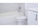 Bathroom features a white shower over tub and toilet at 41975 Aspen St, Eustis, FL 32736