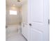 Bathroom boasts sleek marble-look shower tile and a modern vanity at 41975 Aspen St, Eustis, FL 32736