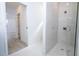 Shower with white tile surround in updated bathroom at 41975 Aspen St, Eustis, FL 32736