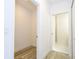 Hallway that opens into the Primary bath and the closet at 41975 Aspen St, Eustis, FL 32736