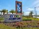 Community entrance sign for Storey Lake, a new home community with tropical landscaping at 4289 Prologue Way, Kissimmee, FL 34746