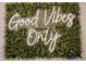 Trendy wall decor with a neon sign that says 