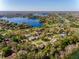 Stunning aerial view of a lakeside community with lush greenery and beautiful homes at 4355 Watermill Ave, Orlando, FL 32817