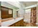 Bathroom featuring neutral tile floor, single sink vanity, and shower-tub combination at 4355 Watermill Ave, Orlando, FL 32817