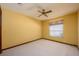 Bedroom featuring neutral carpet, a ceiling fan, and a window with blinds at 4355 Watermill Ave, Orlando, FL 32817