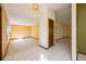 Welcoming foyer featuring neutral tones, tile flooring, and views into carpeted living areas at 4355 Watermill Ave, Orlando, FL 32817