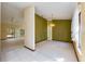 Open-concept living area with carpet flooring, a ceiling fan, and natural light from sliding glass doors at 4355 Watermill Ave, Orlando, FL 32817