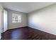 Bedroom with wood floors, a window and white walls at 4405 S Semoran Blvd # 7, Orlando, FL 32822